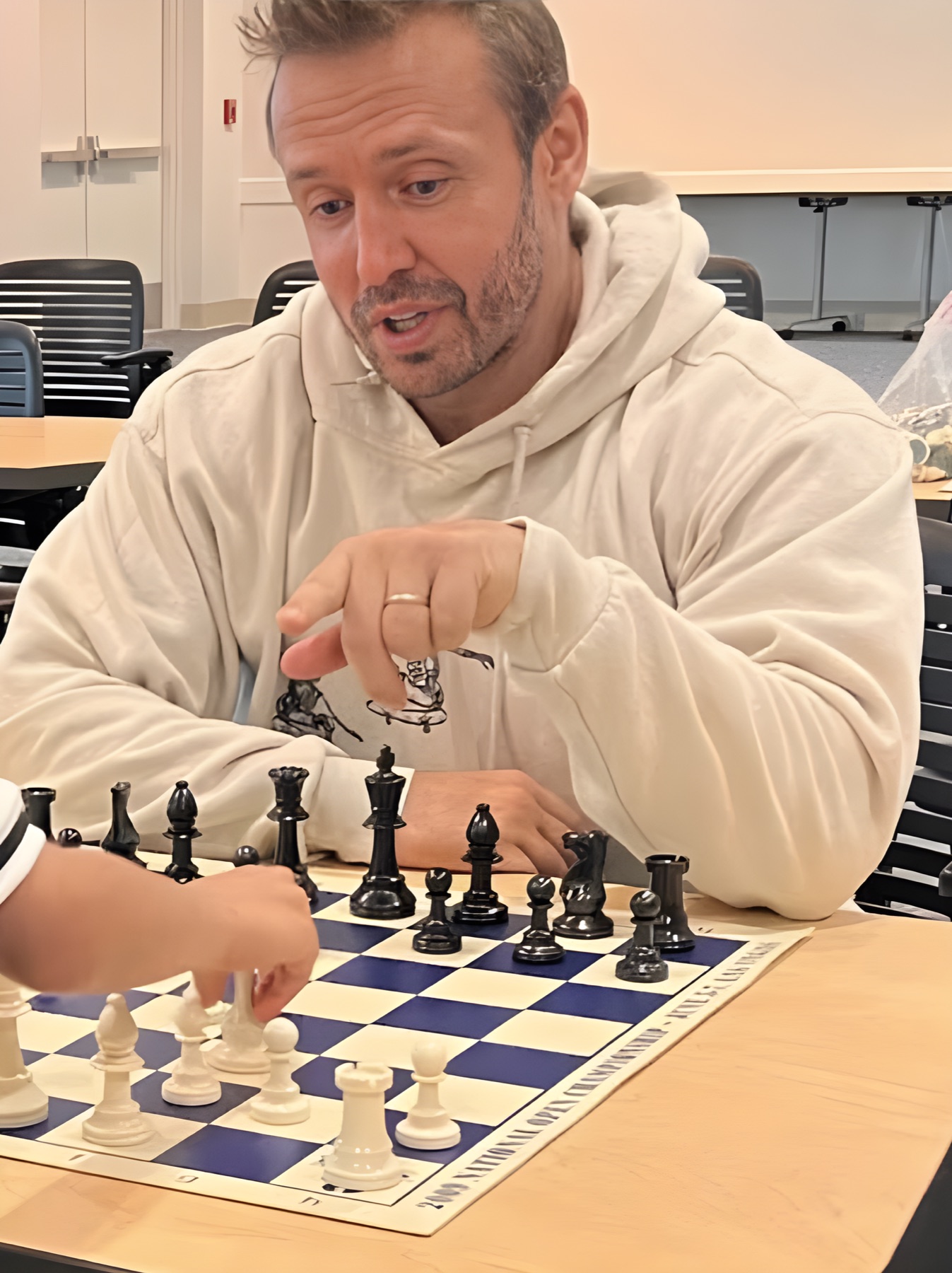 GM Boris Kreiman teaching a child